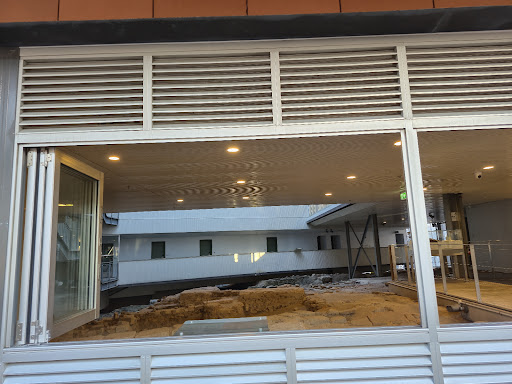 View into The Big Dig heritage area through windows at YHA Sydney Harbour